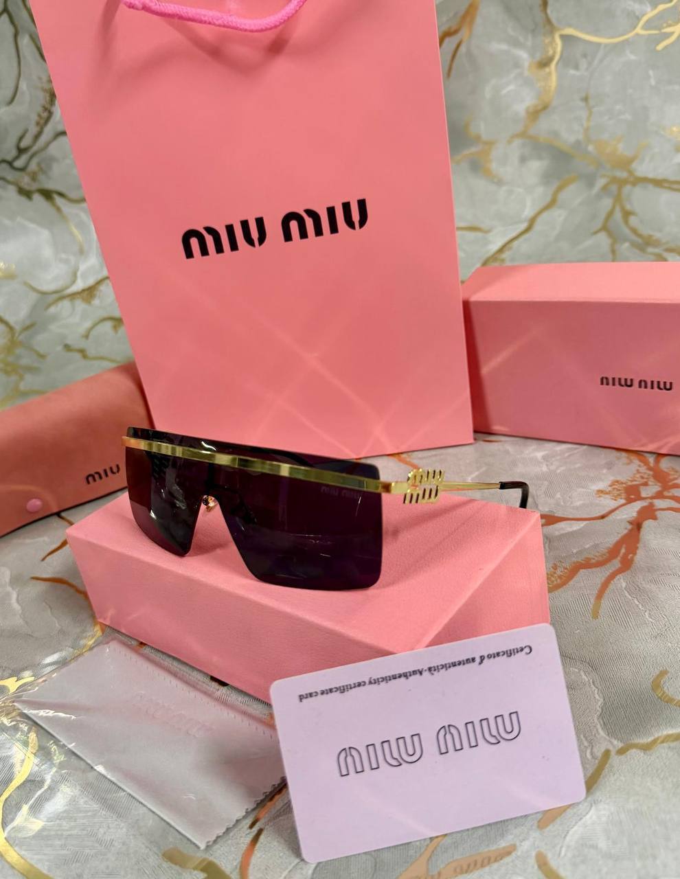 OCCHIALI DA SOLE MIU MIU