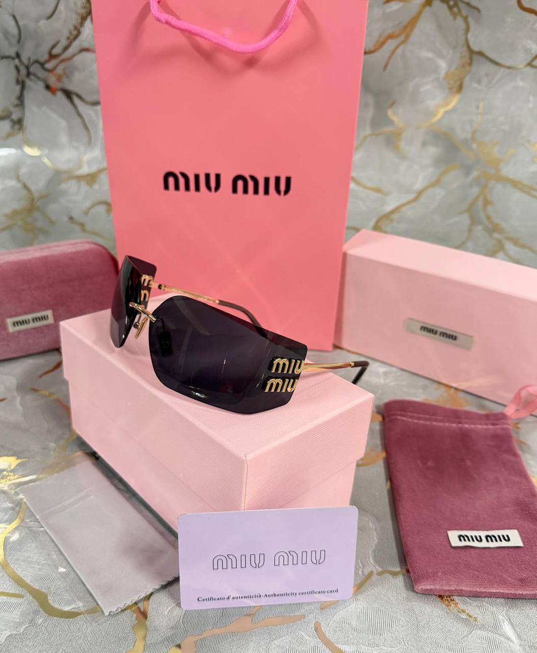 OCCHIALI DA SOLE MIU MIU