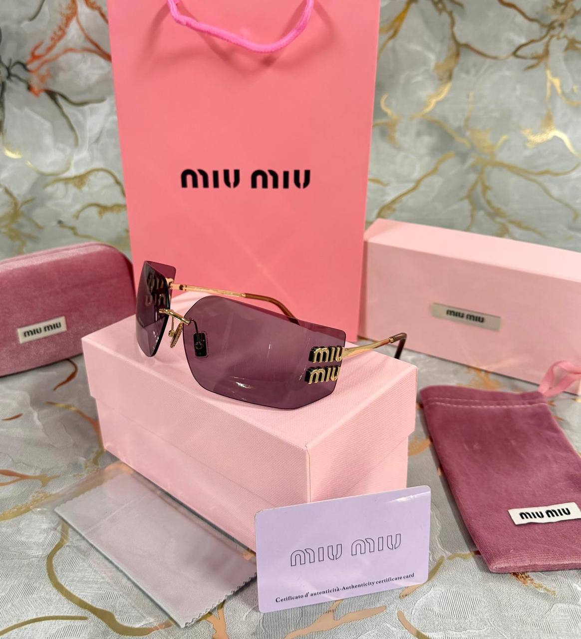 OCCHIALI DA SOLE MIU MIU