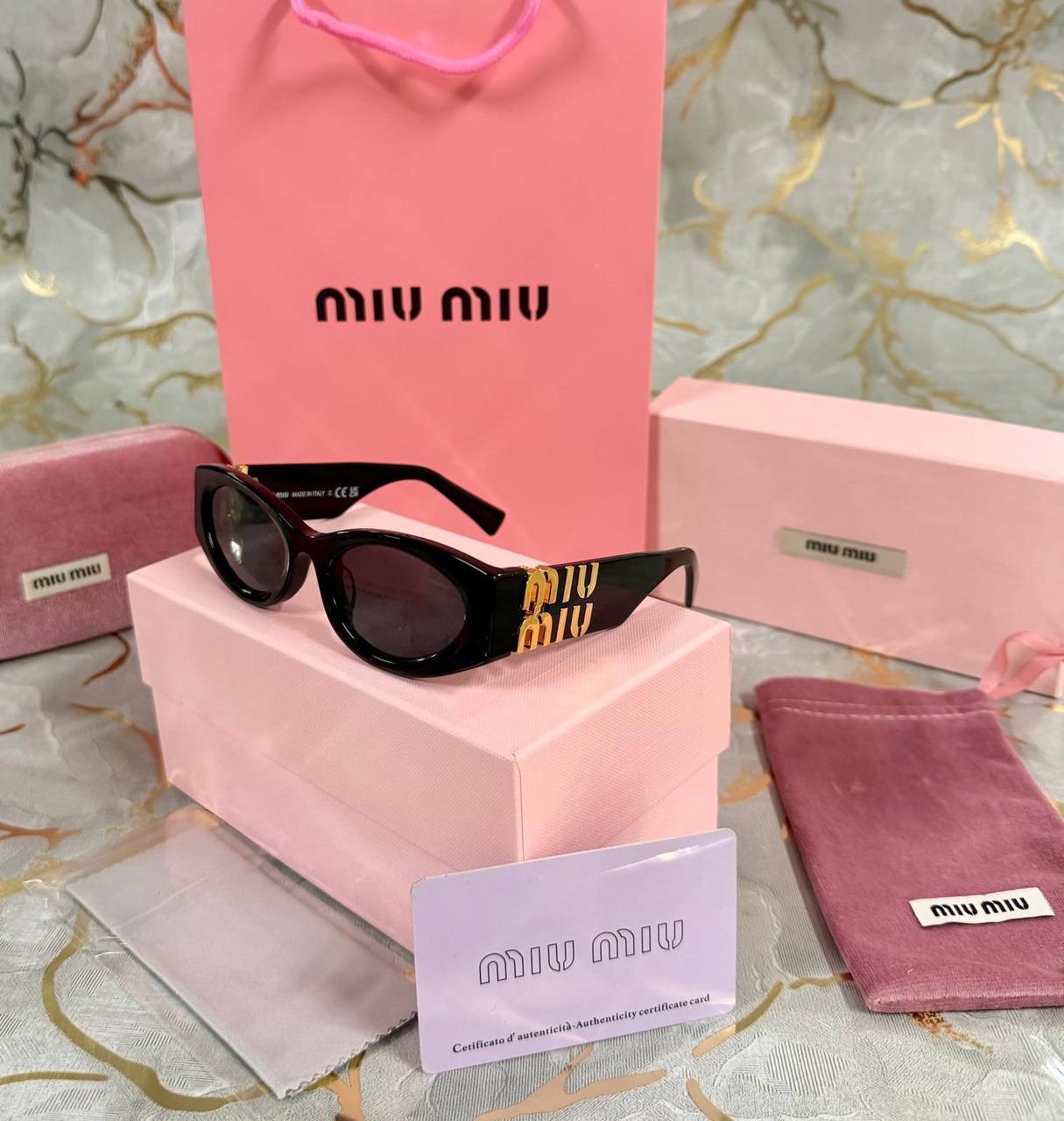 OCCHIALI DA SOLE MIU MIU