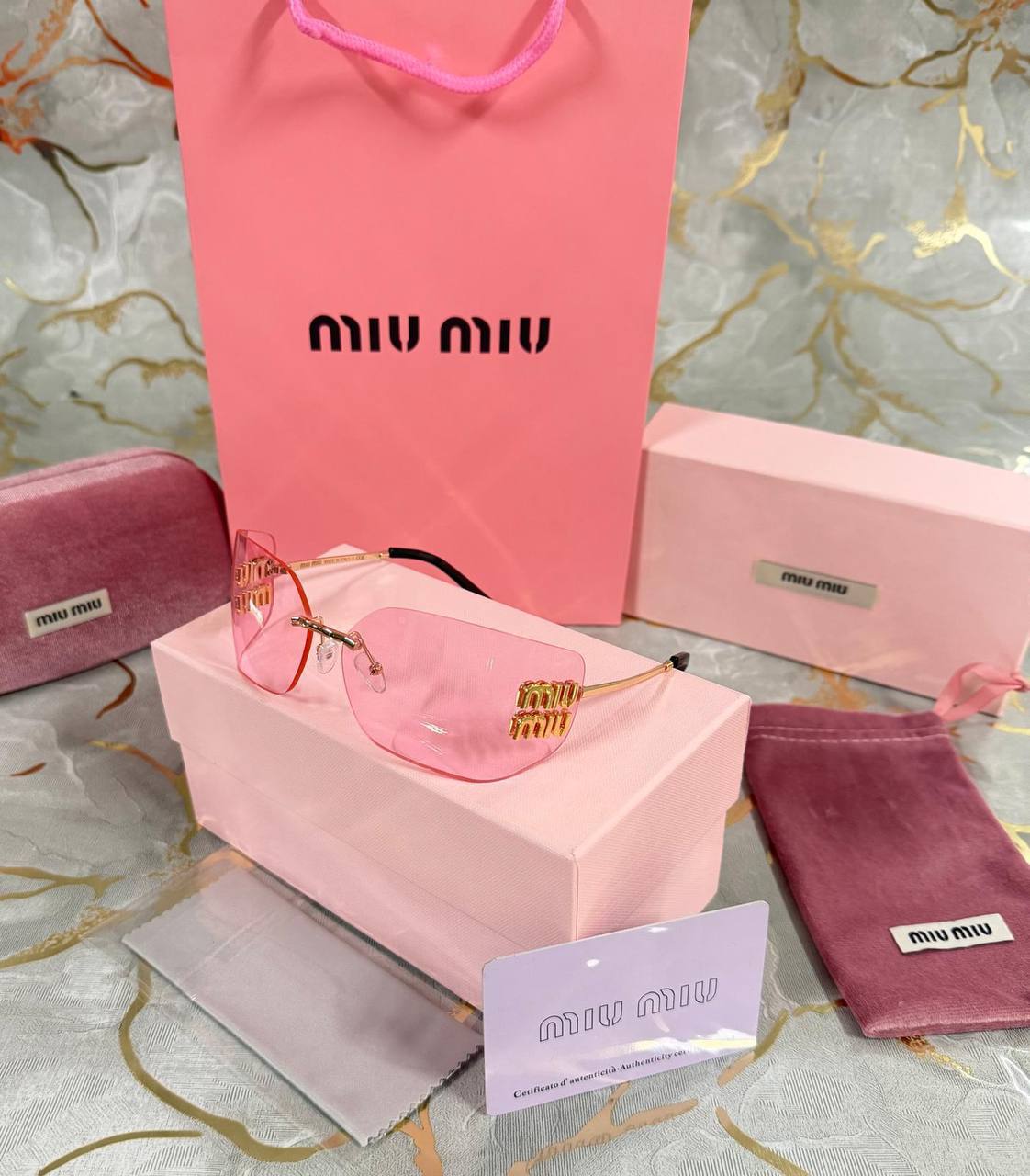 OCCHIALI DA SOLE MIU MIU